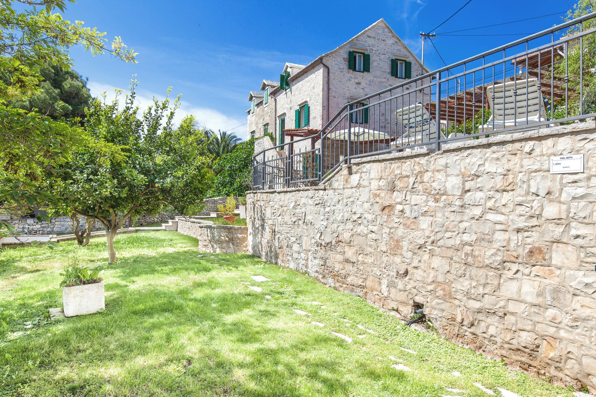 Private garden and olive grove in front of the Villa Bonaca on the island of Brac